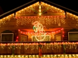 Kerstkaart: Huis met heel veel kerstverlichting