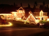 Kerstkaart: Huizen met veel kerstverlichting